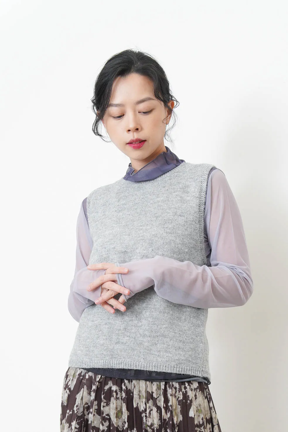 Ivory knit vest w/ strings back details