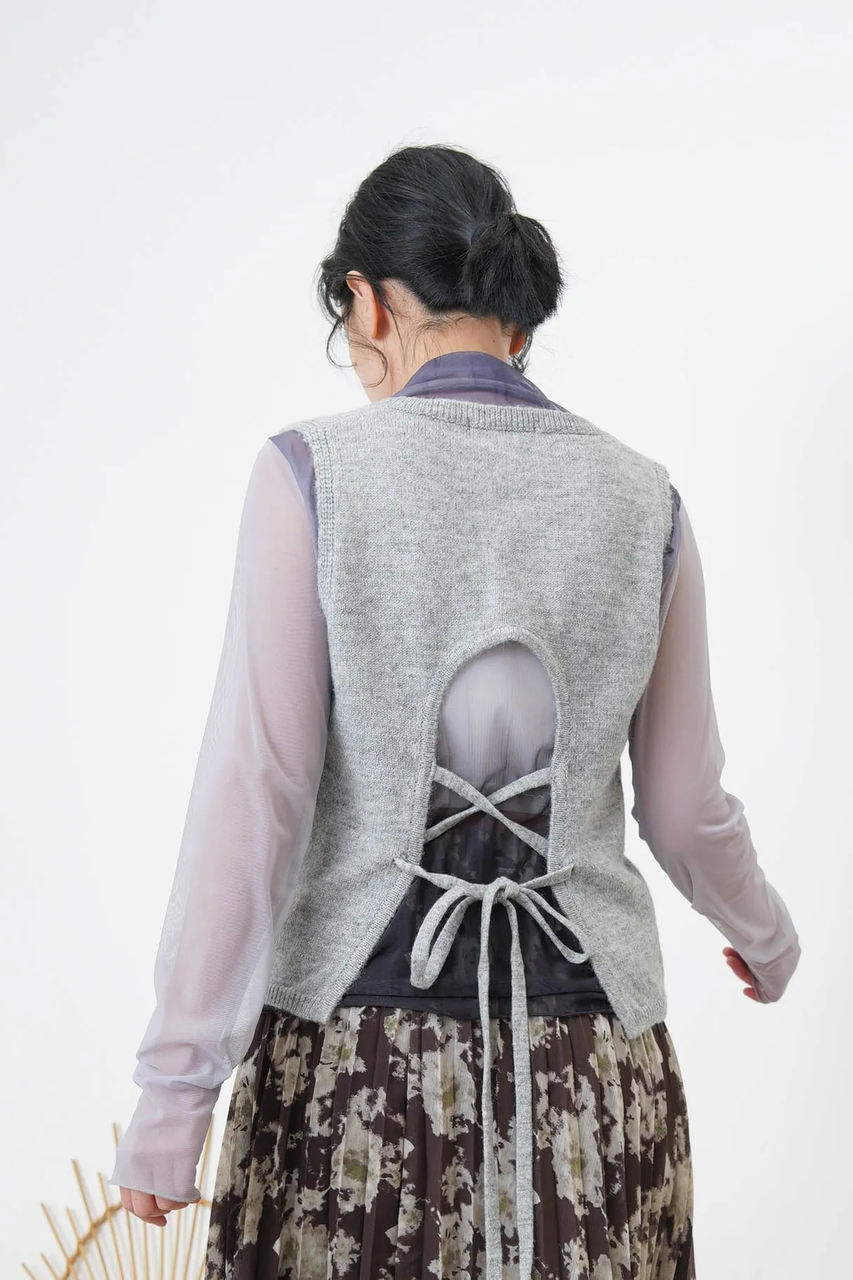 Ivory knit vest w/ strings back details